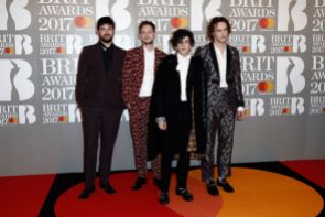 The 1975 in paisley print suits